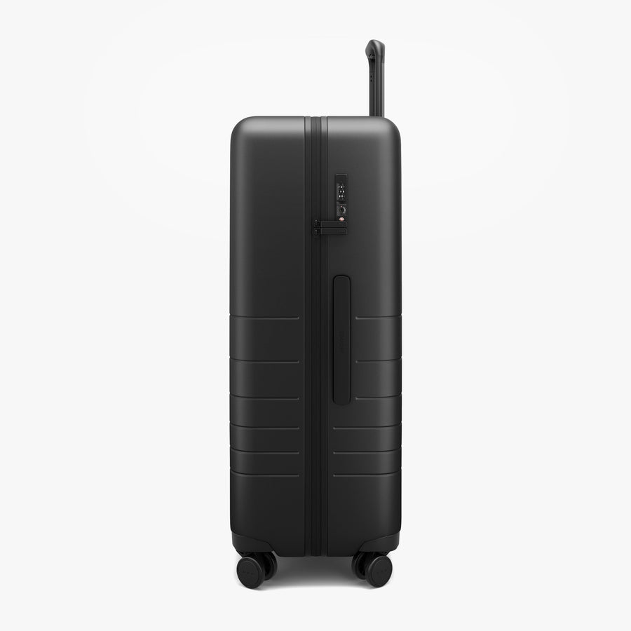 Midnight Black | Side view of Check-In Large in Midnight Black
